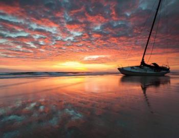 boat on water at sunset