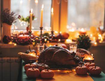 turkey and thanksgiving food in a cozy kitchen scene