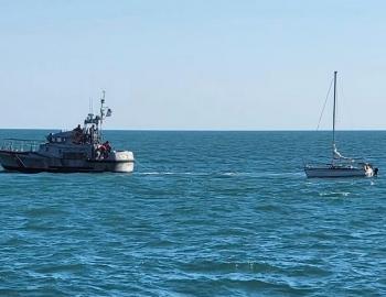 47' Coast Guard Lifeboat tows a damaged sailboat to safety. 47' Coast Guard Lifeboat tows a damaged sailboat to safety.