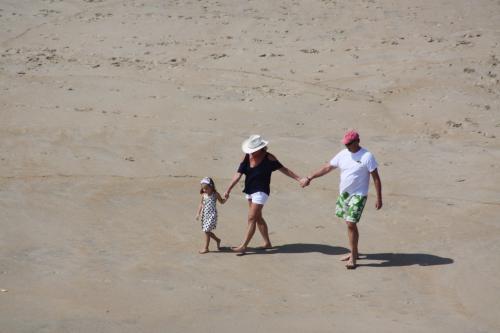 A family walking on the beach in Ocean Dunes